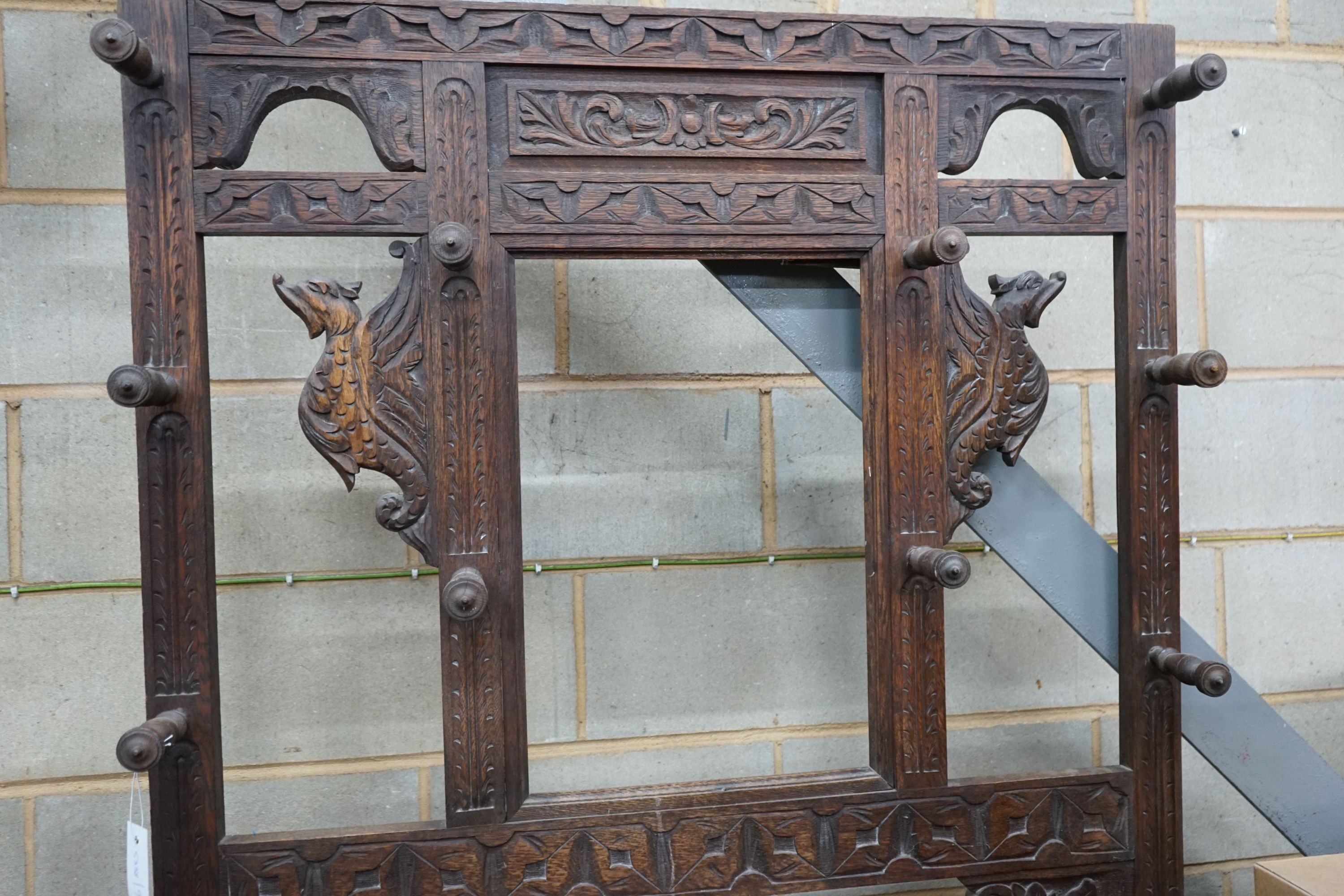 A late 19th century Flemish carved oak hallstand, width 106cm, depth 36cm, height 198cm